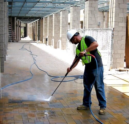 Power washing by professional building cleaning services near me restoring exterior surfaces